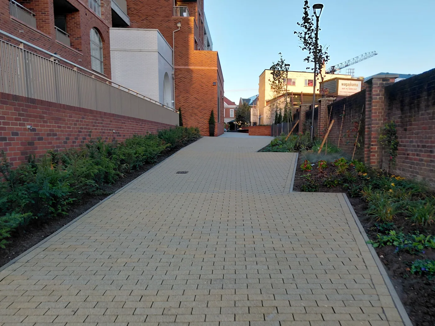 Chandlers Walk, the new paved path from the High Street towards Suffolk Way, with planted beds along both sides