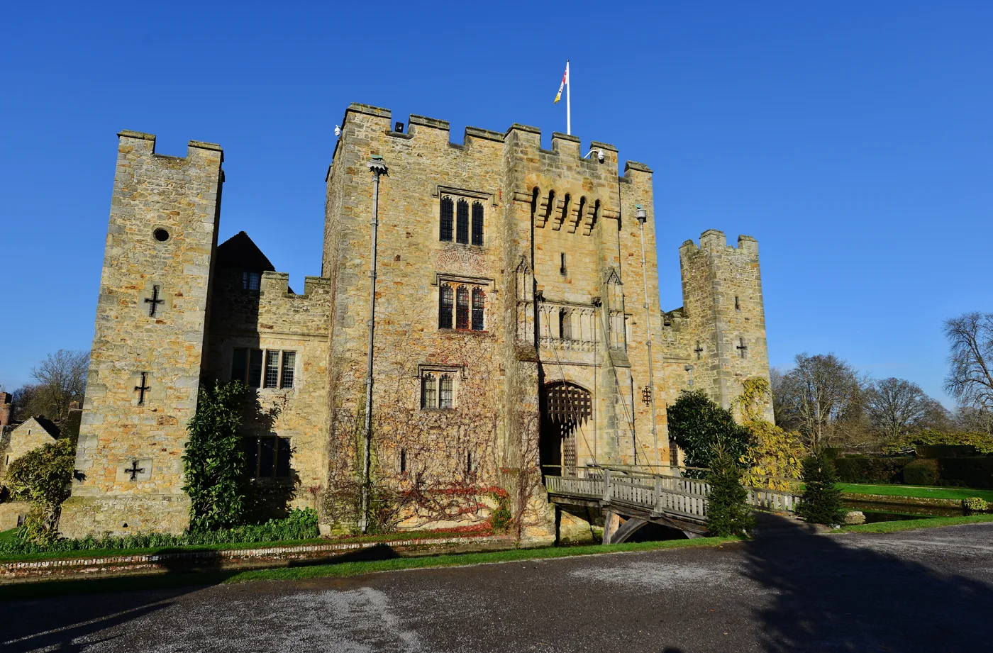 The gatehouse and the wooden drawbridge over the inner moat at Hever Castle, the way visitors cross into the building.