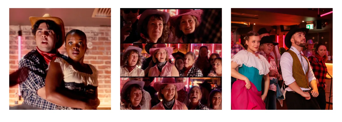 Performers in Wild West costume dancing among the audience