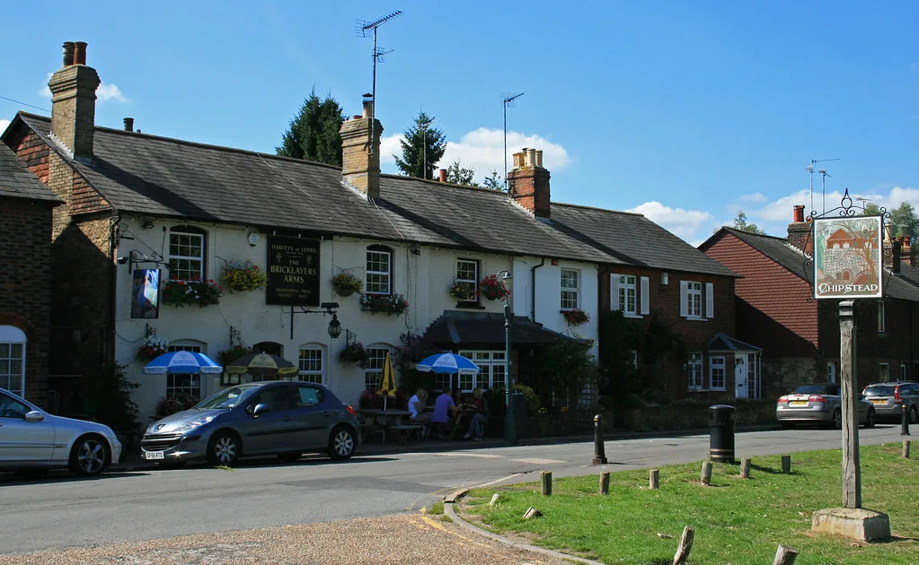 Outside tables at the Bricklayers Arms on the green at Chipstead, opposite the sailing lake.
