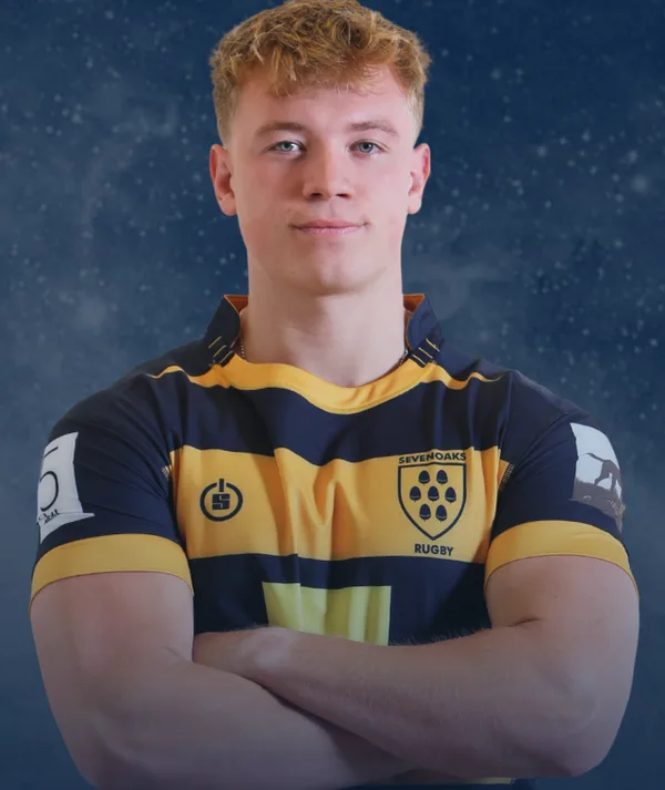 Olly Green, the new Sevenoaks RFC 1st XV captain, arms folded, wearing the club's navy and gold hooped shirt